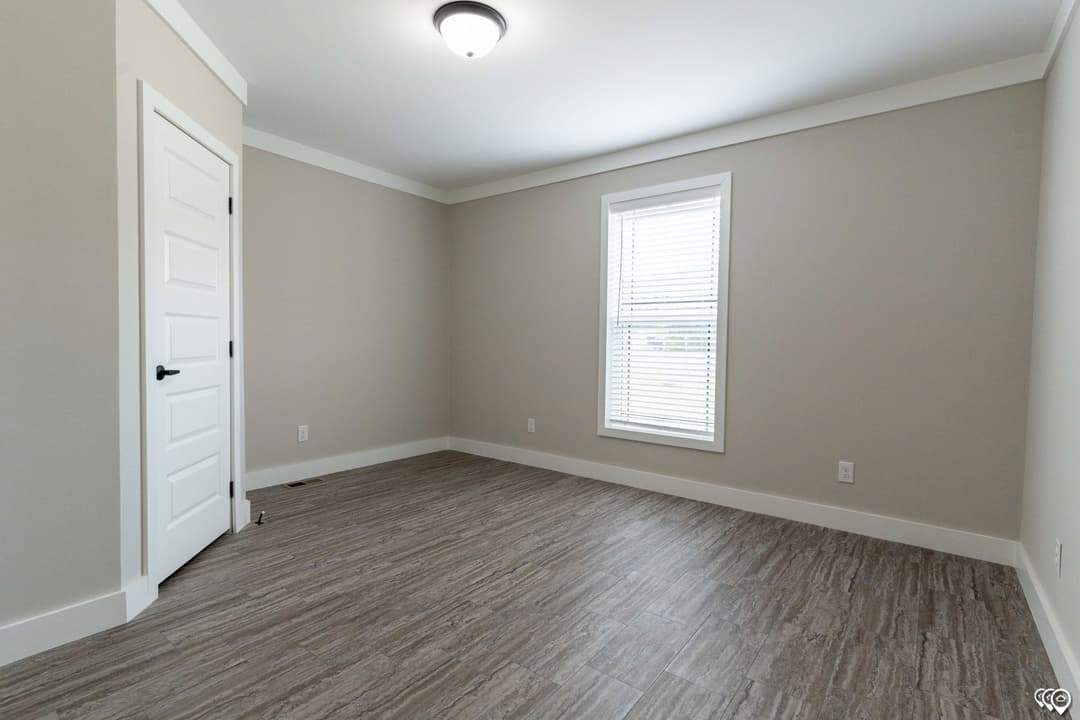 The barndominium bedroom home features